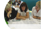 Three female academics discussing research and evidence-informed educational policy and practice